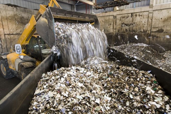 Solid waste after being shredded to a uniform size.