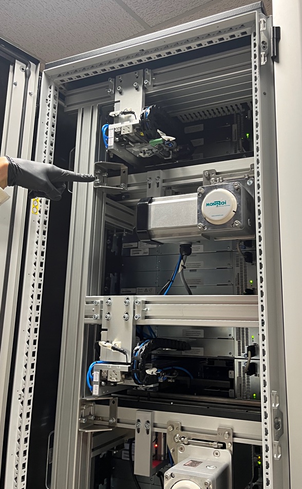 Rear view of Cerabyte library rack showing robot and Montech conveyor system